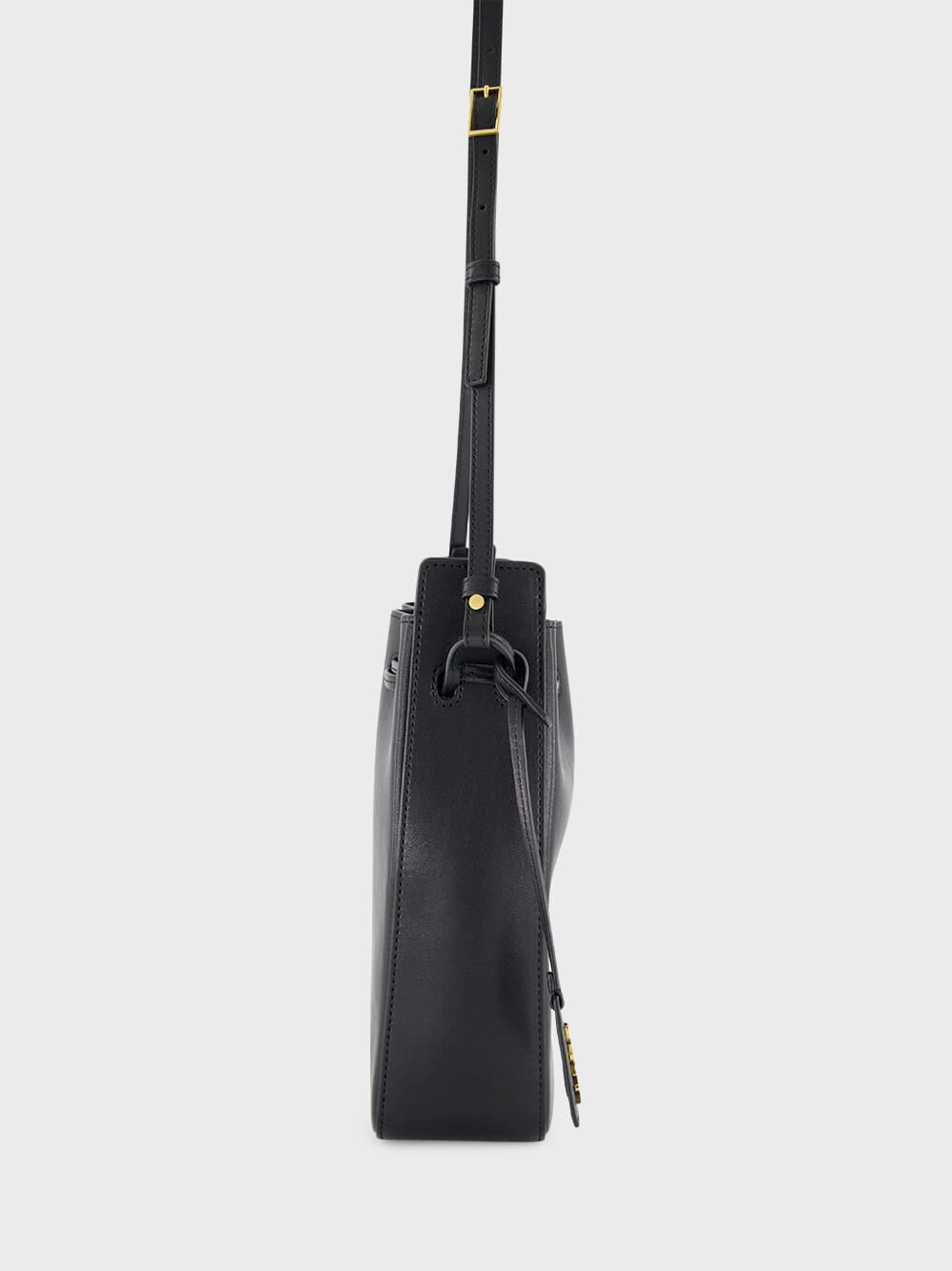 Black Leather Bucket Bag with Cassandre Charm