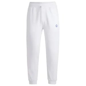 Cotton-terry tracksuit bottoms with Happy HUGO logo patch