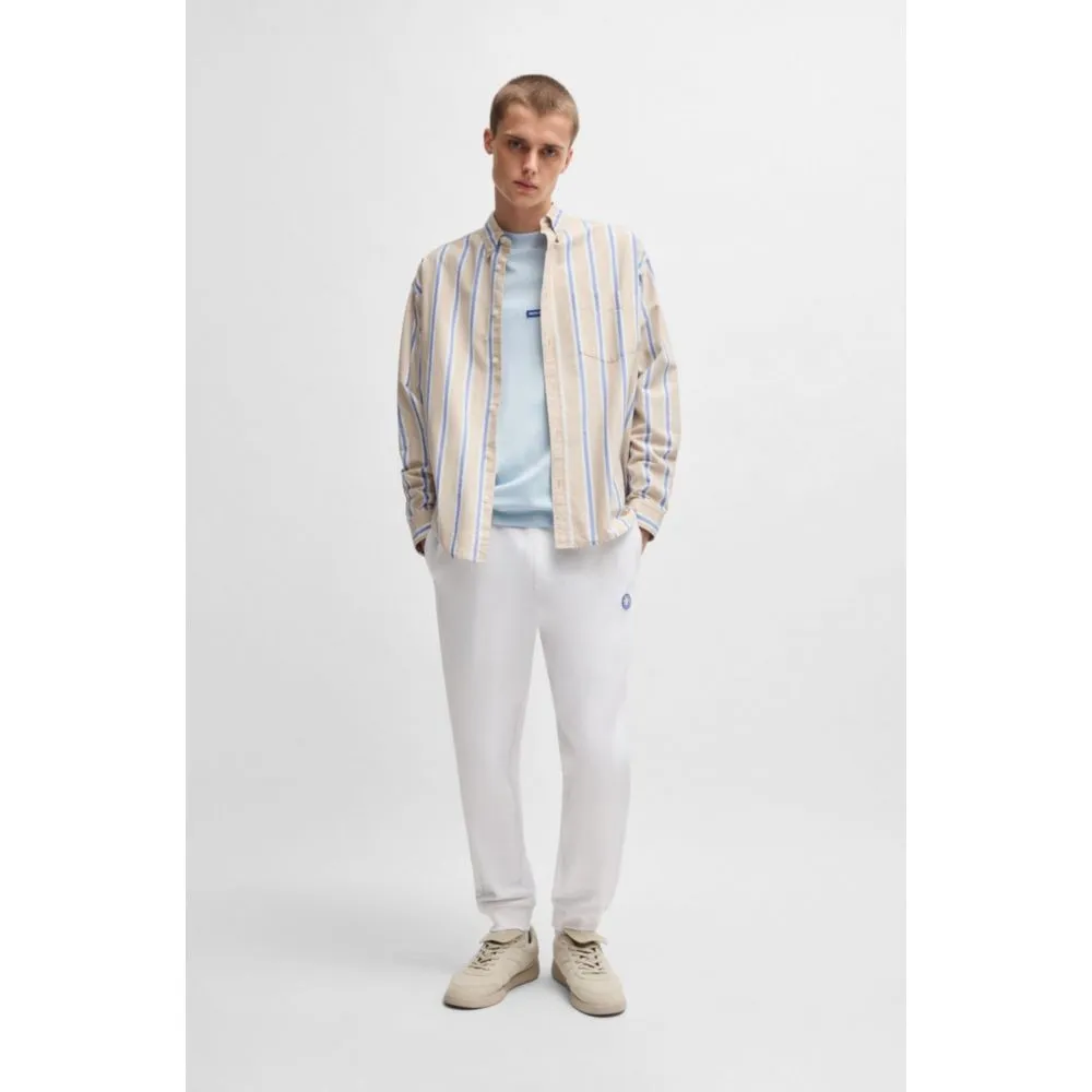 Cotton-terry tracksuit bottoms with Happy HUGO logo patch