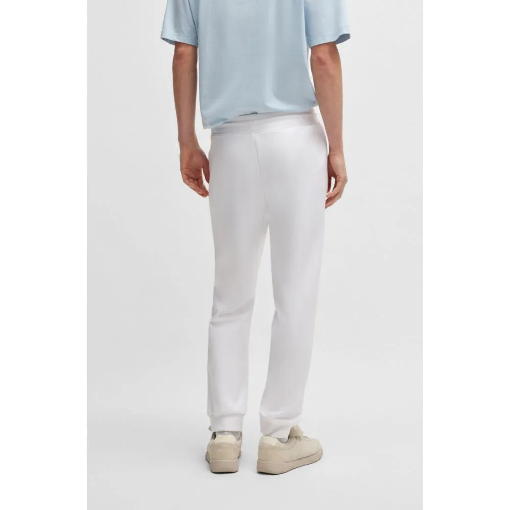 Cotton-terry tracksuit bottoms with Happy HUGO logo patch