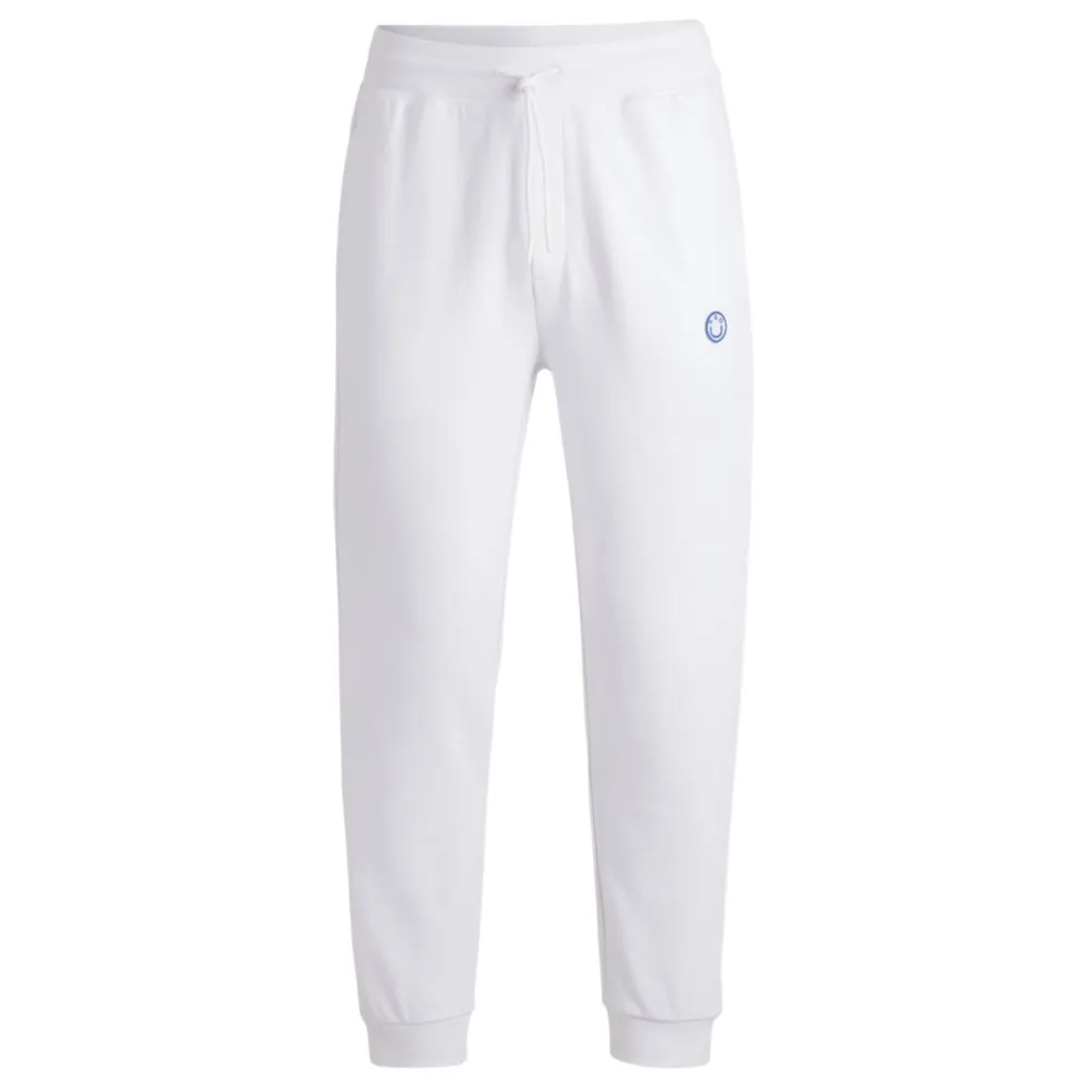 Cotton-terry tracksuit bottoms with Happy HUGO logo patch
